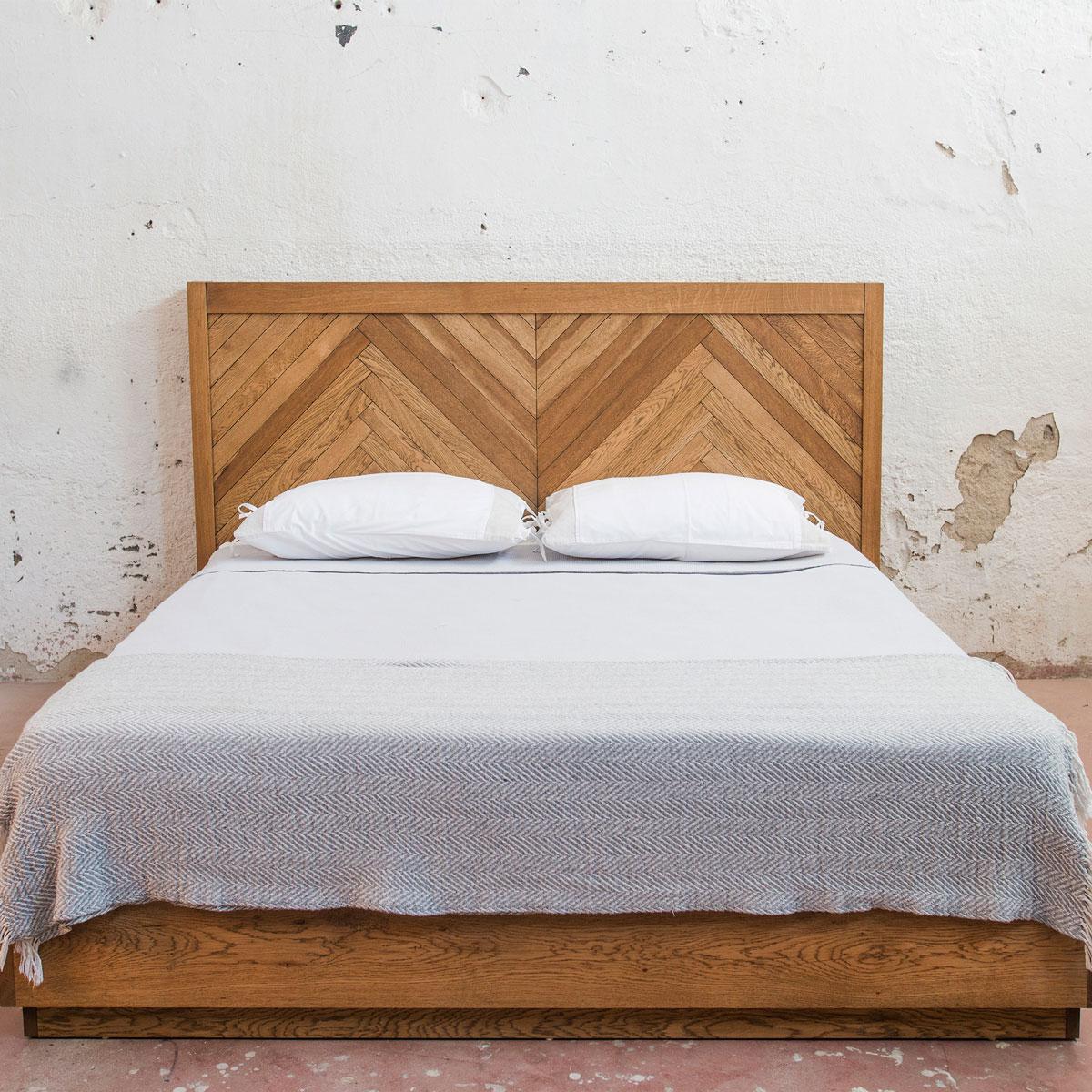 The HERRINGBONE Series Solid Oak Bed combines the strength and warmth of solid oak wood with a modern, refined take on the classic chevron pattern. The handcrafted headboard features intricate herringbone detailing, offering both visual elegance and