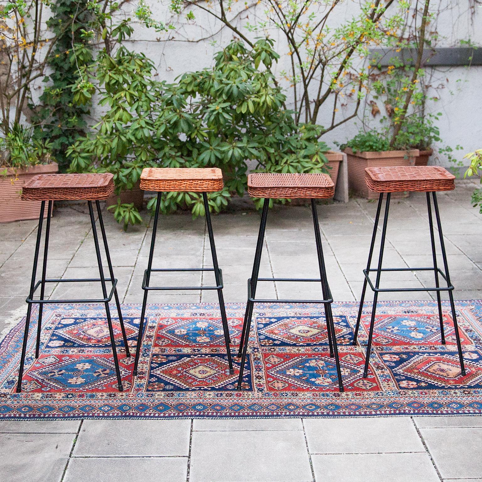 Set of six bar stools designed by Herta Maria Witzemann and manufactured by Erwin Behr in 1950. The work of Witzemann typically consists out of light and vibrant structures, which have a feeling of lightness to it and woven cane was often used as a