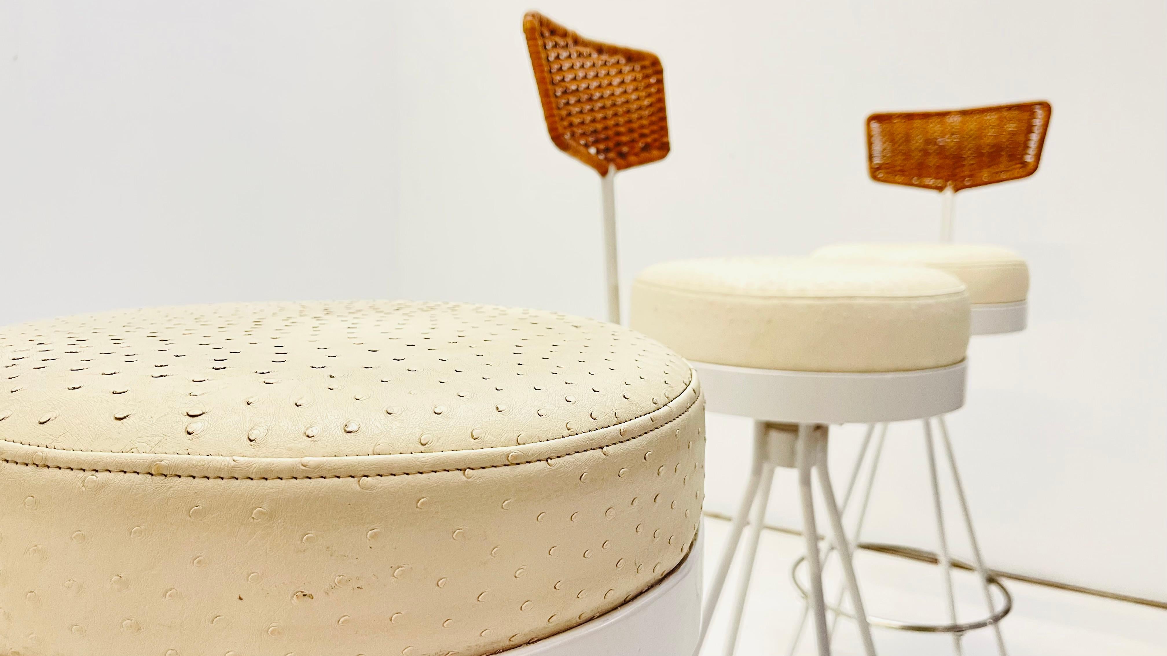 Set of 4 bar stool by Herta-Maria Witzemann from 1950. Theses Stools are made out of sturdy steel tubes with a white crocodile skin on the highly confortable seats and a nice wicker flexible backrest. 

These rare pieces are fully restored in the