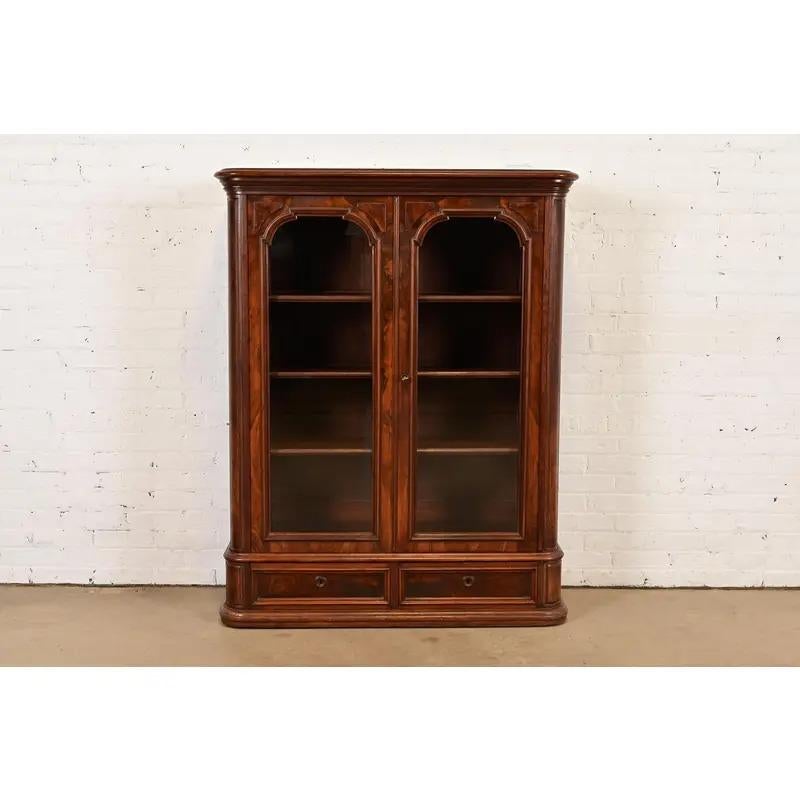 A beautiful antique Victorian bookcase cabinet

In the manner of Herter Brothers

USA, Circa 1880s

Gorgeous burled walnut, with glass front doors. Cabinet locks, and key is included.

Measures: 43.5