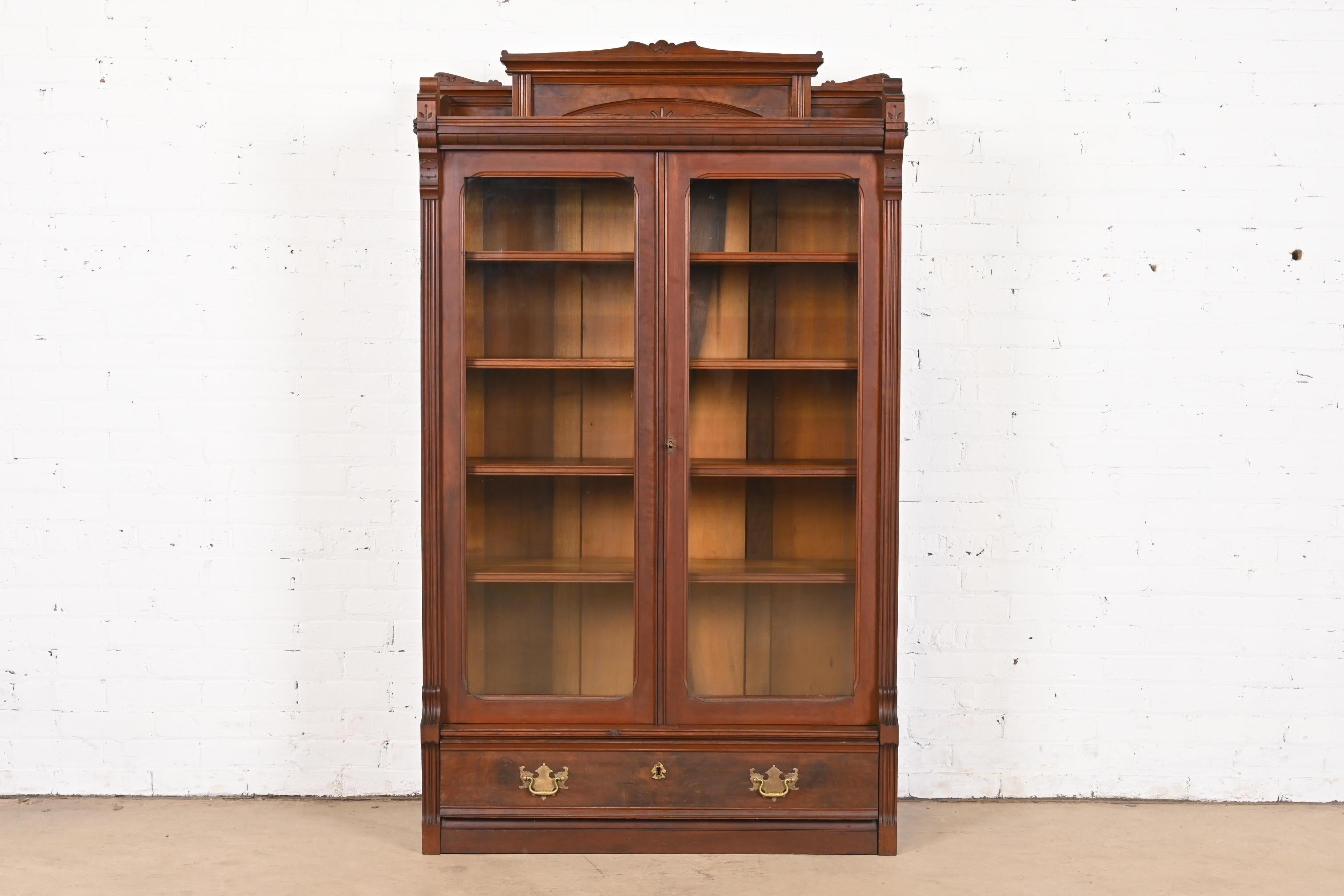 American Herter Brothers Style Eastlake Victorian Carved Walnut and Burl Wood Bookcase