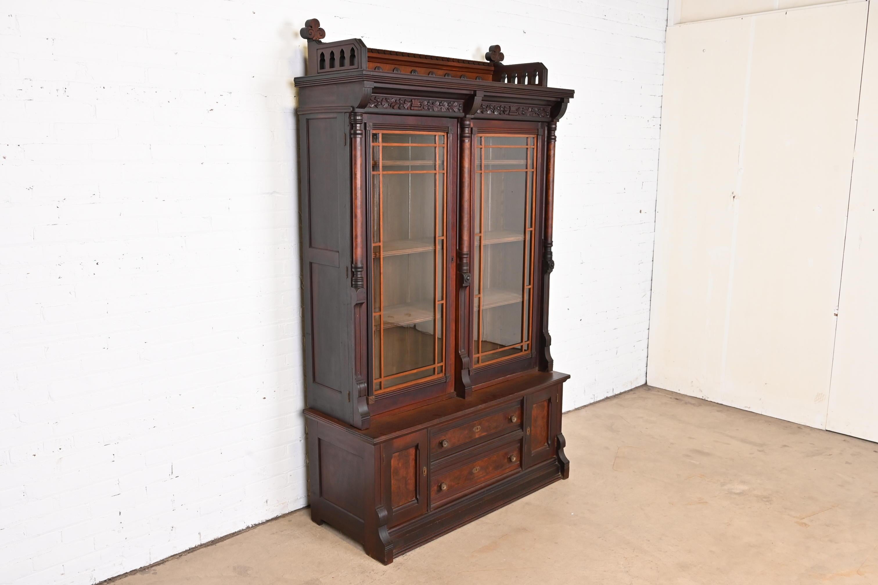 American Herter Brothers Style Eastlake Victorian Carved Walnut and Burl Wood Bookcase