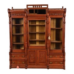 Herter Brothers Style Eastlake Victorian Carved Walnut Bookcase, Circa 1880s