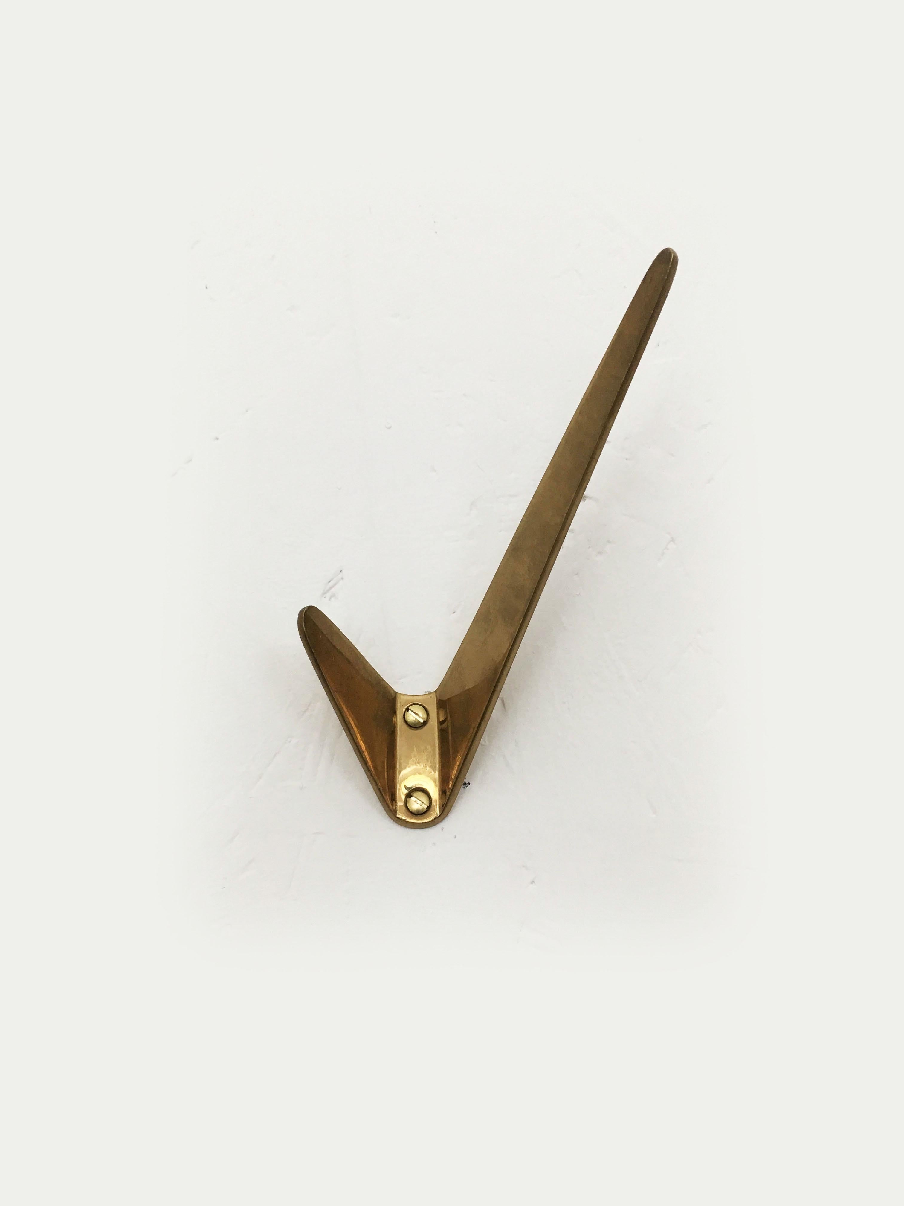 Hertha Baller Polished Brass Wall Hooks Model 'Neubau'. Beautiful Austrian modernist brass wall hooks, executed in the 1950s by Hertha Baller, Austria. Made of solid polished brass, in good condition with lovely patina. Sold and priced per piece. Up