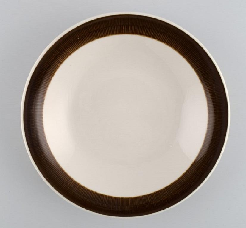 Hertha Bengtson (1917-1993) for Rörstrand. 
Four Koka deep plates in glazed stoneware. 1960s.
Measures: 20.5 x 4 cm.
In excellent condition.
Stamped.
For almost half a century, Hertha Bengtson was one of Sweden's leading designers in ceramics