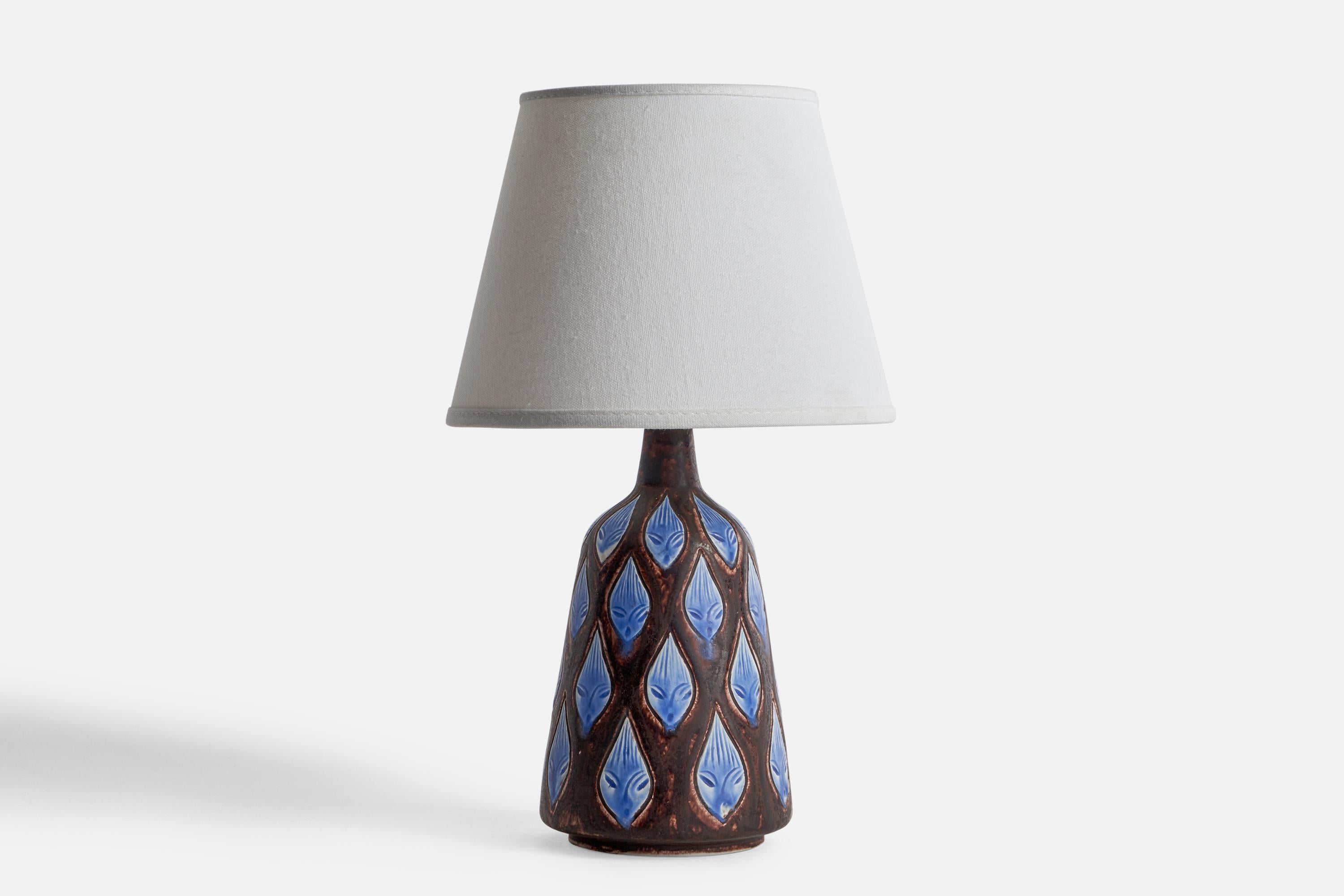 A brown and blue-glazed and incised table lamp designed by Hertha Bengtson and produced by Rörstrand, Sweden, 1960s.

Dimensions of Lamp (inches): 10.5” H x 4.53” Diameter
Dimensions of Shade (inches): 4.5” Top Diameter x 10” Bottom Diameter x 5.25”