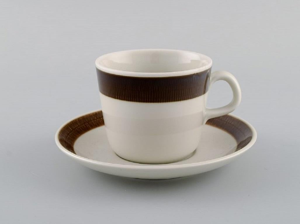 Hertha Bengtsson 1917-1993 for Rörstrand. 
10 Koka coffee cups with saucers in glazed stoneware. 1960s.
The coffee cup measures: 8 x 6.5 cm.
In excellent condition.
Stamped.
For almost half a century, Hertha Bengtson was one of Sweden's leading
