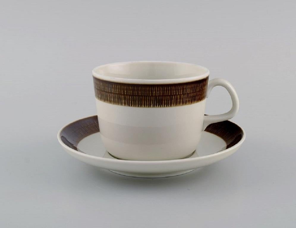 Hertha Bengtsson 1917-1993 for Rörstrand. 
Four Koka teacups with saucers in glazed stoneware. 1960s.
The teacup measures: 9.5 x 7 cm.
Saucer diameter: 15 cm.
In excellent condition.
Stamped.
For almost half a century, Hertha Bengtson was one