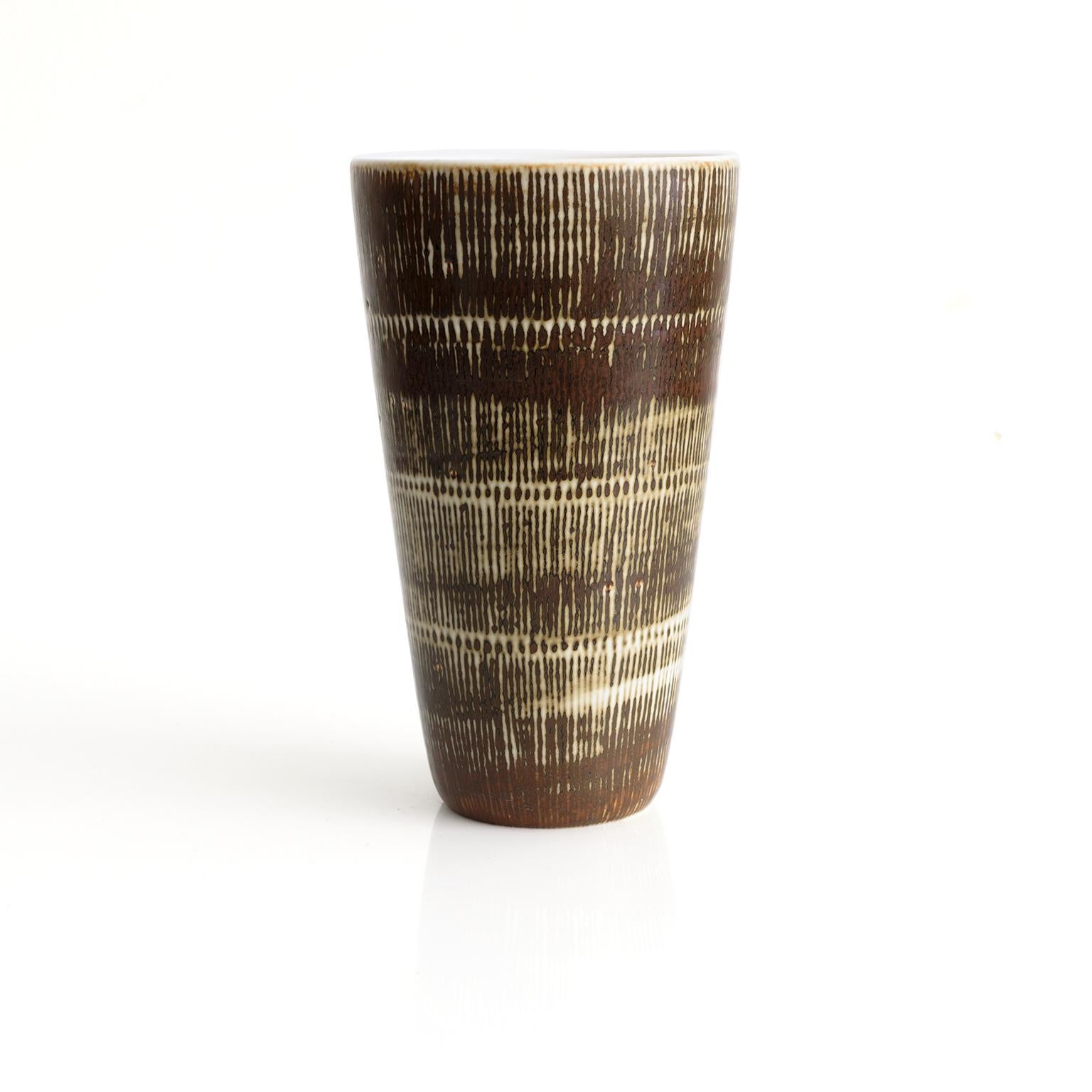 Hertha Bengtsson designed conical form Swedish mid-century vase produced at Rorstrand, Studio, circa 1960. Bengtsson was a master of pattern and texture and this piece is a fine example of thee skills. Over glazed brown over a creamy white, signed