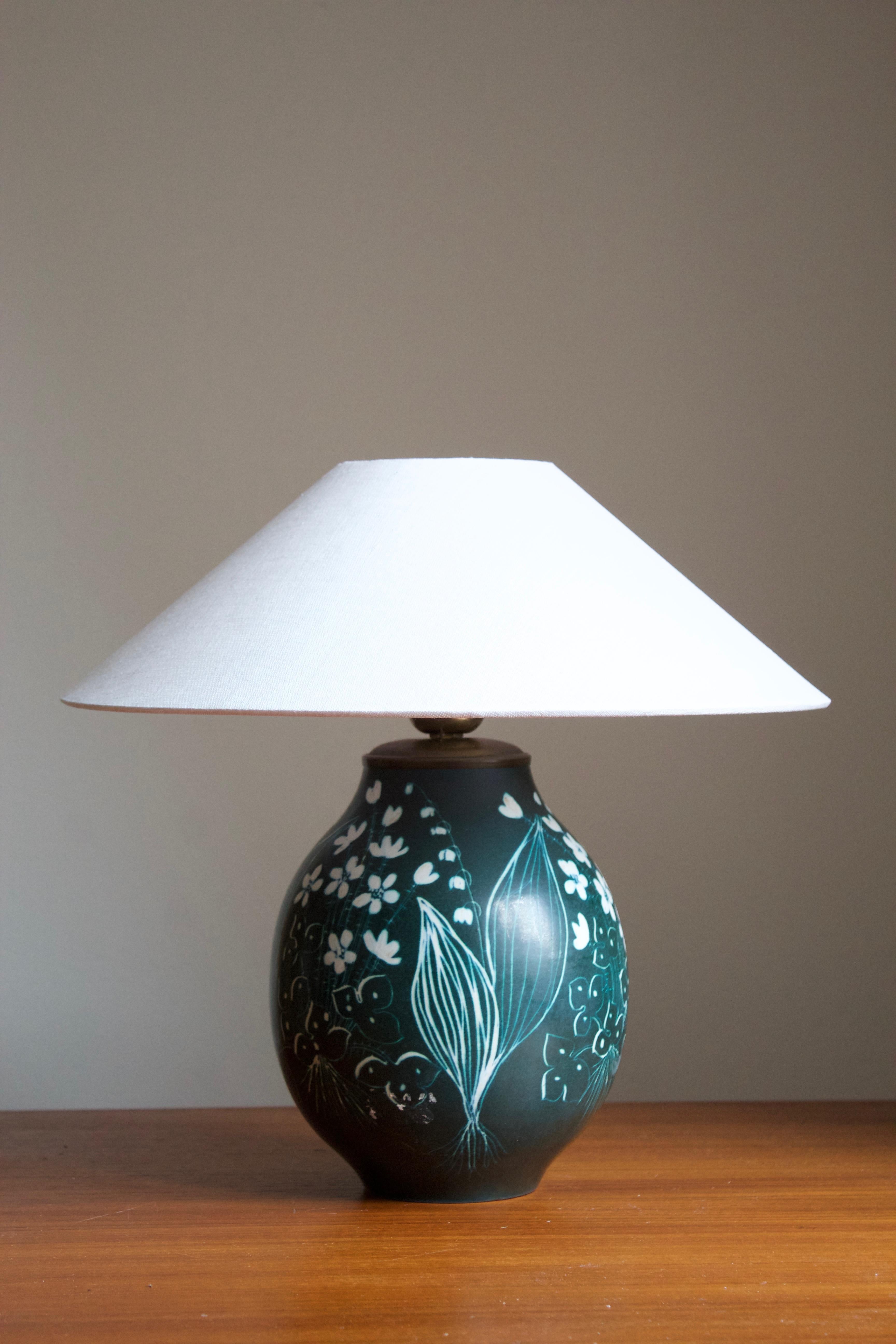 A table lamp produced by Rörstrand, Sweden, 1950. Designed by Hertha Bengtsson, (Swedish, 1914-1997). Signed.

Stated dimensions excluding lampshade. Height includes socket. Sold without lampshade.

Other ceramicists of the period include Axel