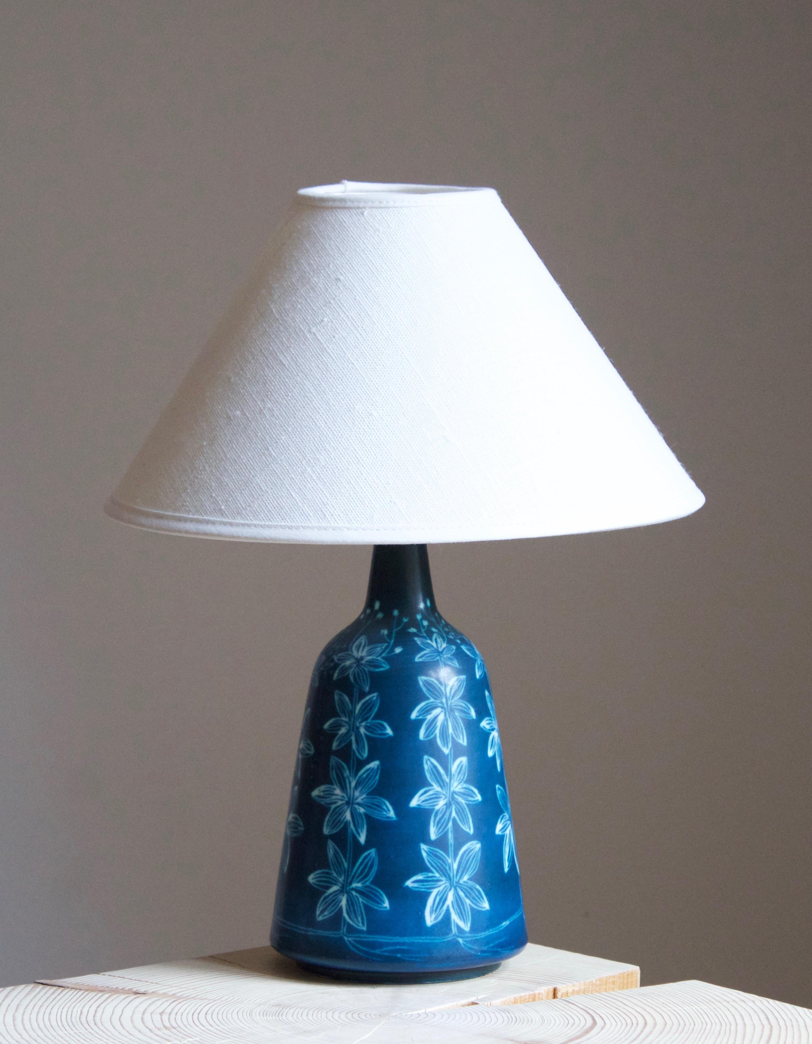 A table lamp produced by Rörstrand, Sweden, 1950. Designed by Hertha Bengtsson, (Swedish, 1914-1997). Signed.

Stated dimensions excluding lampshade. Height includes socket. Sold without lampshade.

Other ceramicists of the period include Axel
