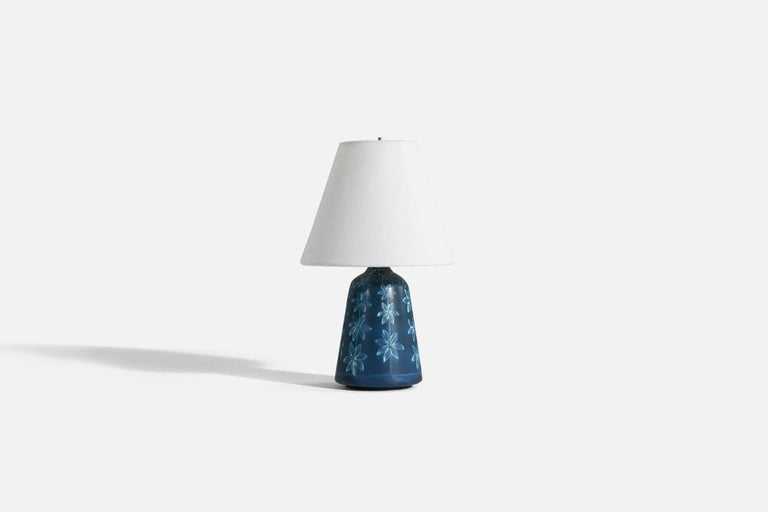 A blue glazed table lamp designed by Hertha Bengtsson, and produced by Rörstrand, Sweden, 1950s. Signed and marked.

Sold without lampshade. 

Dimensions of Lamp (inches) : 10 x 4.5 x 4.5 (H x W x D)
Dimensions Shade (inches) : 4 x 8 x 6.75 (T