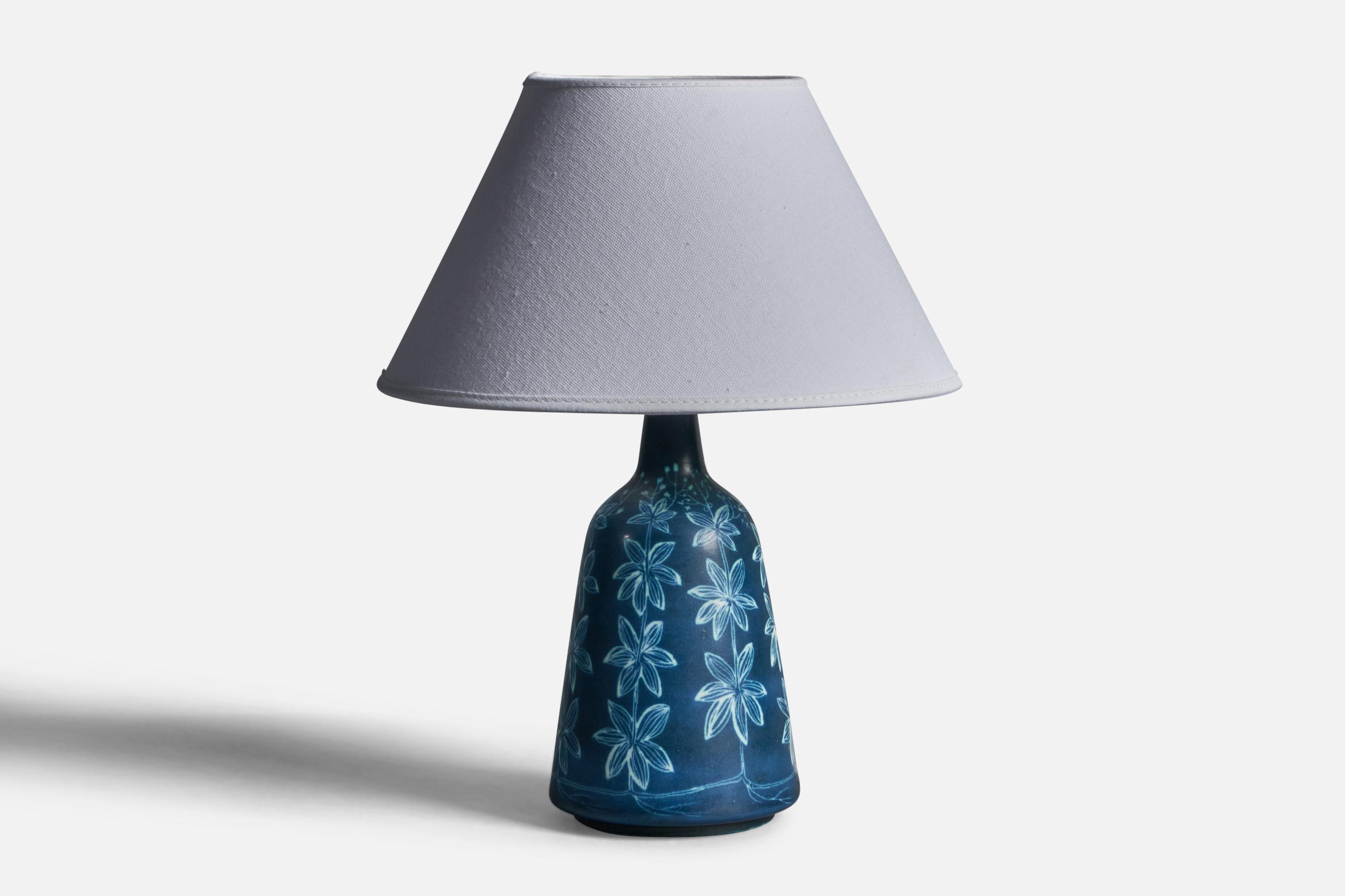 A blue-glazed painted table lamp designed by Hertha Bengtsson and produced by Rörstrand, Sweden, 1950s.

Dimensions of Lamp (inches): 10
