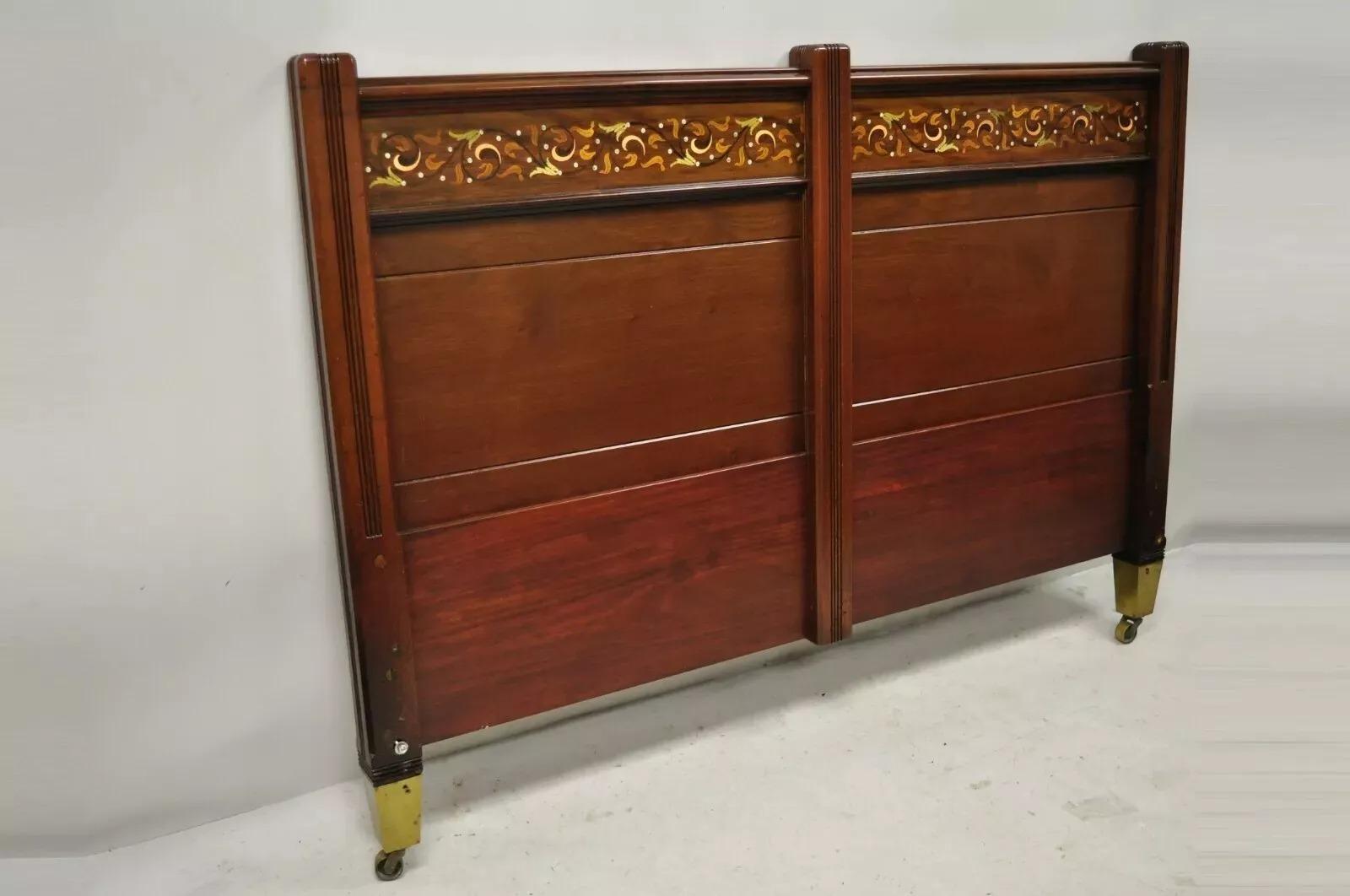 Herts Brothers Brass Satinwood Inlay Edwardian Mahogany Queen Bed Headboard. Item features brass and satinwood scrollwork inlay, brass capped feet, rolling casters, solid wood frame, beautiful wood grain, unmarked, quality American craftsmanship.