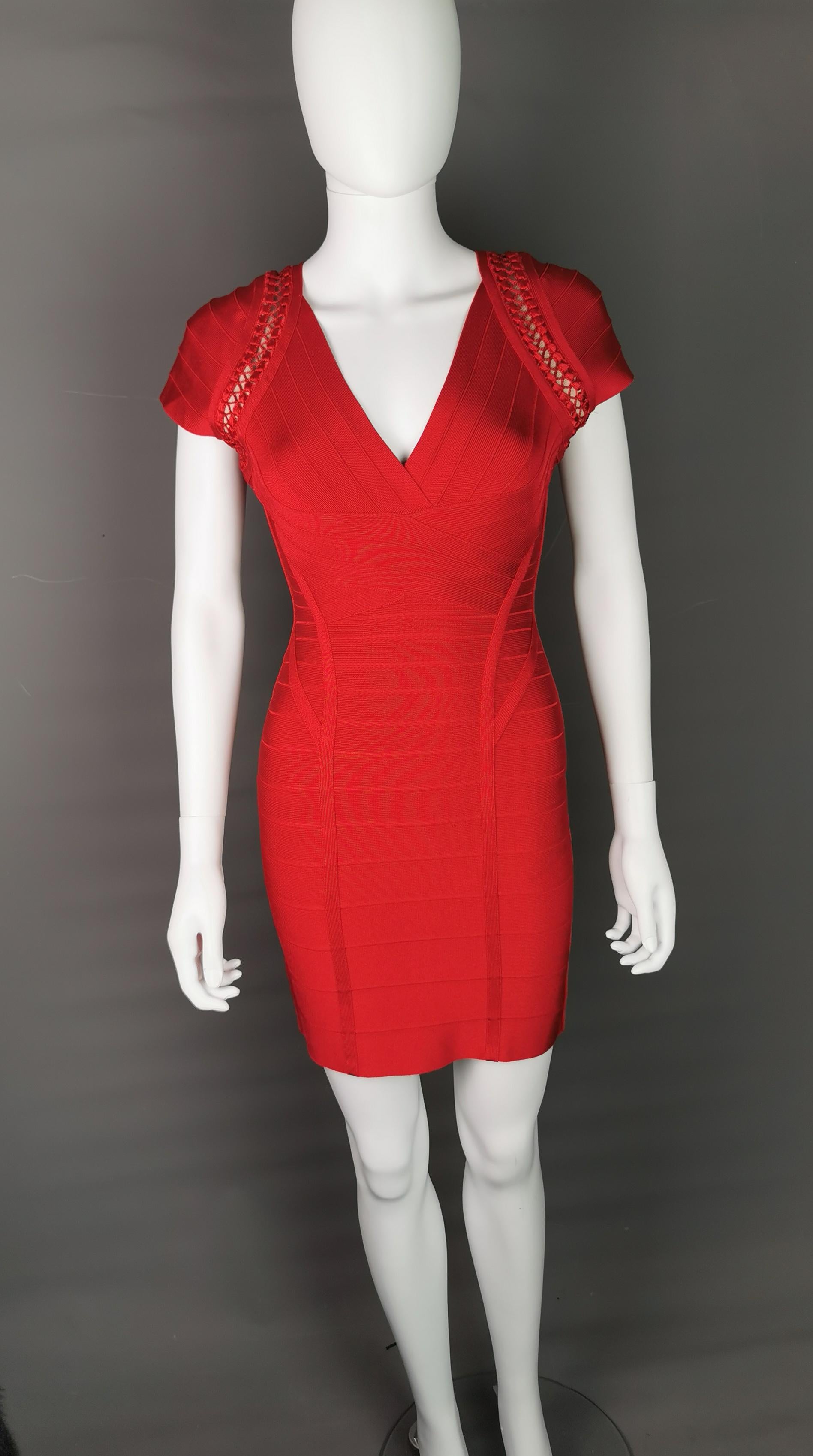 Turn some heads in this stunning Herve Leger by Max Azria bandage dress.

Iconic figure hugging dress in the signature bandage style with crochet detailing to the capped sleeves.

It is a gorgeous vibrant lipstick red colour and is in great