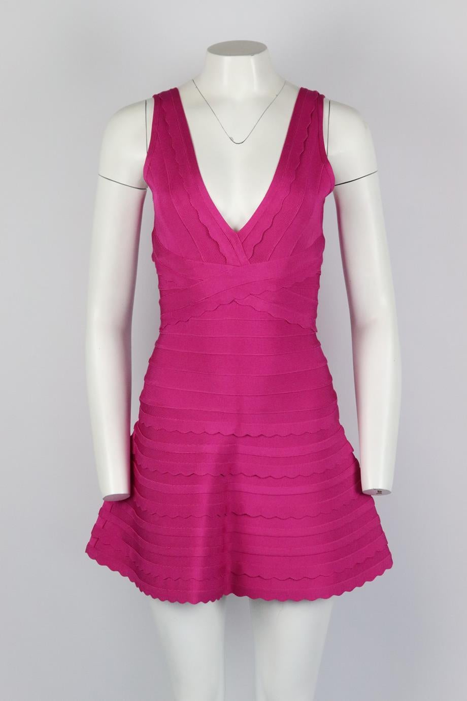 Herve Leger bandage mini dress. Pink. Sleeveless, v-neck. Zip fastening at back. 91% Rayon, 8% nylon, 1% spandex. Size: Small (UK 8, US 4, FR 36, IT 40). Bust: 32 in. Waist: 23 in. Hips: 41 in. Length: 32 in. Very good condition - Hem has been taken