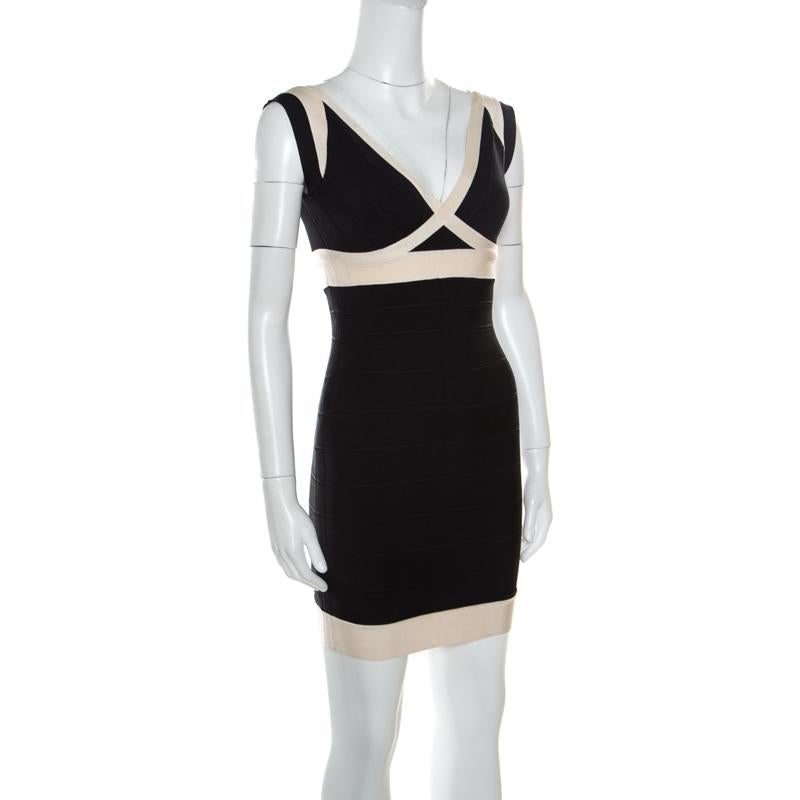 Every detail of this Ilia dress from Herve Leger makes a statement and imparts a chic finish. It features bandage construction that creates a sleek silhouette and a broad plunging neckline. The stunning combination of black and cream hues along with