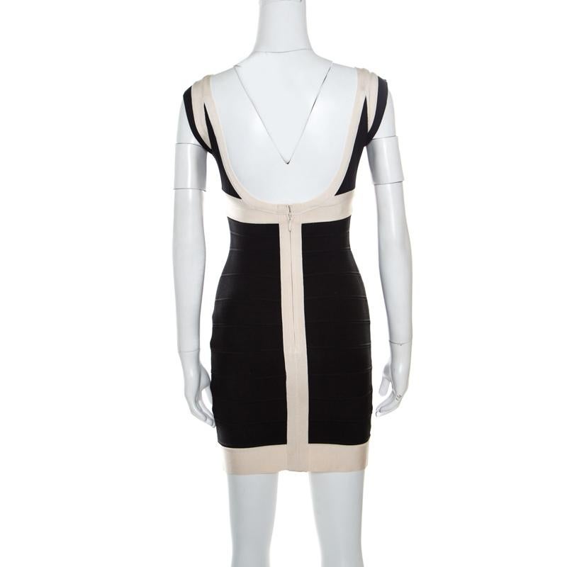 Every detail of this Ilia dress from Herve Leger makes a statement and imparts a chic finish. It features bandage construction that creates a sleek silhouette and a broad plunging neckline. The stunning combination of black and cream hues along with