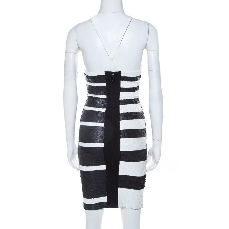 This exquisite Herve Leger dress is sure to get you attention each every time you go out. Go all out and style this black creation with matching shoes and a clutch. This lovely blended fabric attire makes for an apt pick for any event when paired