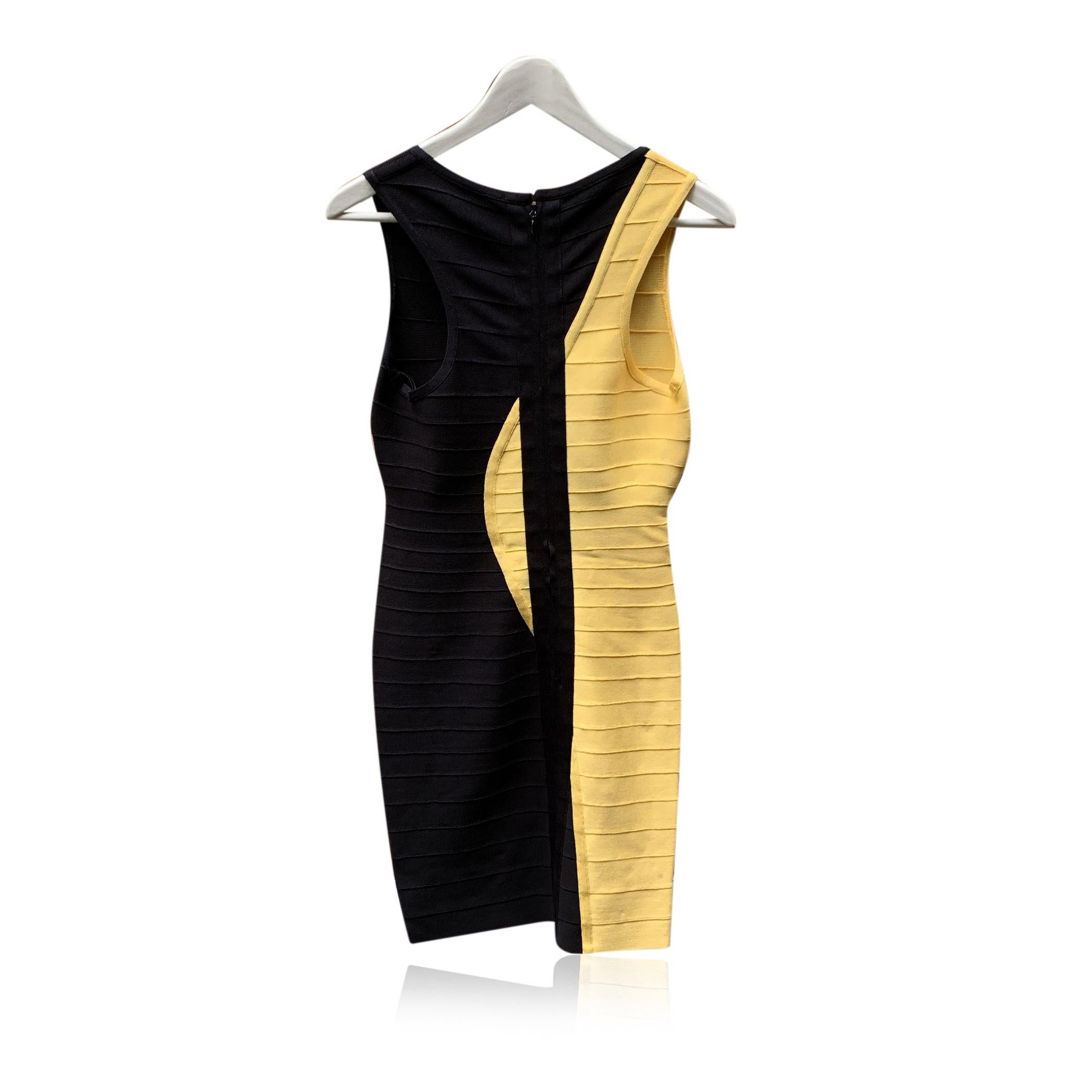 Herve Leger 'Radiant Sun' mini sleeveless dress. Colorblock design in black and bright yellow. Crafted from a elastic rayon fabric. Rear zip closure. Unlined. Size: SMALL Condition A - EXCELLENT Gently used. Please check the photos carefully and ask