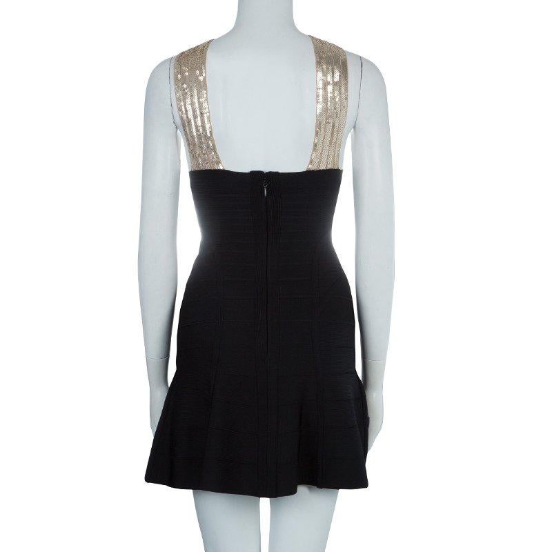 This beautiful Herve Leger dress is all you need for your ladies night out. Cut from rayon blend fabric, this black dress accentuates one's silhouette in the most admirable way. This Herve Leger dress features crossover strap shoulders with sequin