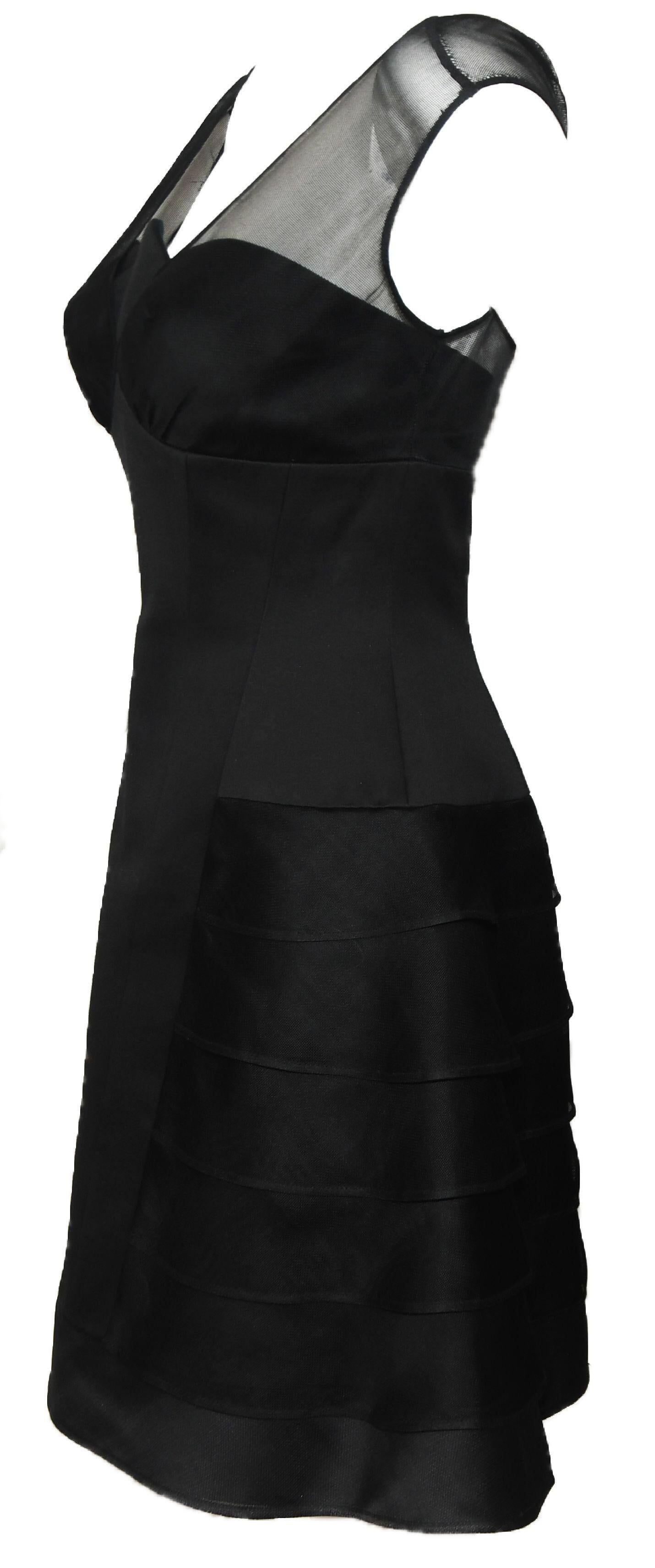 Vintage Herve Leger Paris black cotton and silk dress exemplifies the craftsmanship that made Leger a household name in the 1990's.  Mini features wide-set V-neckline in tulle/mesh and straight low back that exposes a hint of skin through the tulle.