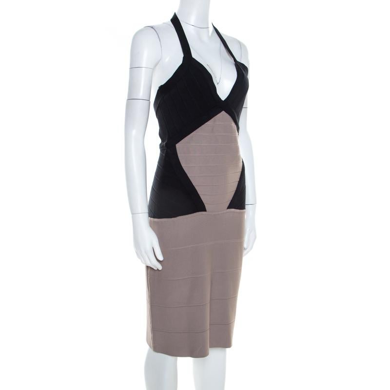 Herve Leger brings to you this fabulous colorblock dress suitable for all fashionable outings. Ingeniously crafted from knit bandages, the rayon blend dress features zip closure at the rear. Complementing pumps and a tote will automatically spice up