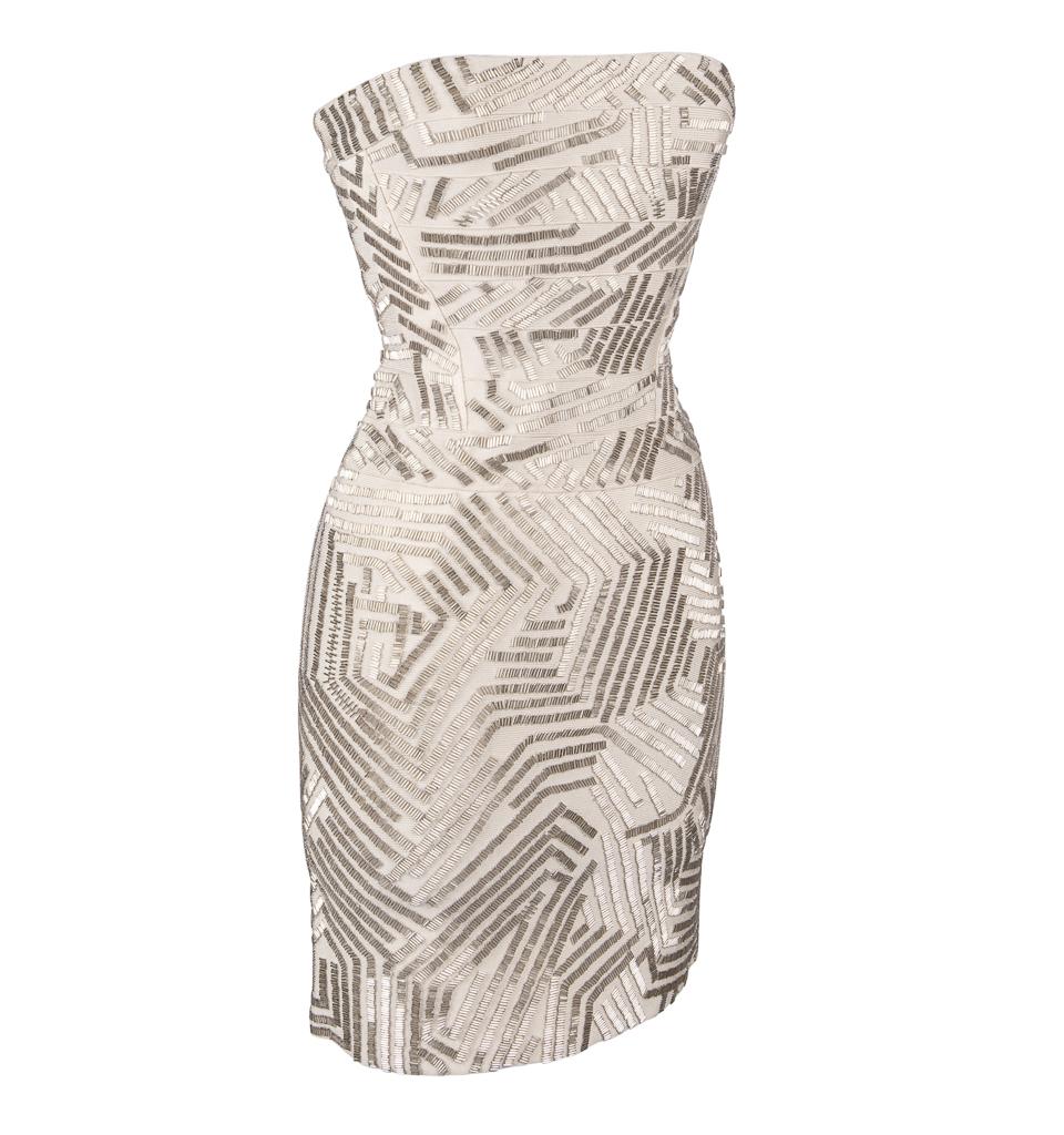 Exquisite strapless Herve Leger dress adorned with silver bugle beads.
Beads are designed at angles that flatter the body from every turn.
Awesome fit of the legendary Leger .
Official color: Birch. 
NEW or NEVER WORN.  Tags attached.
Fabric is