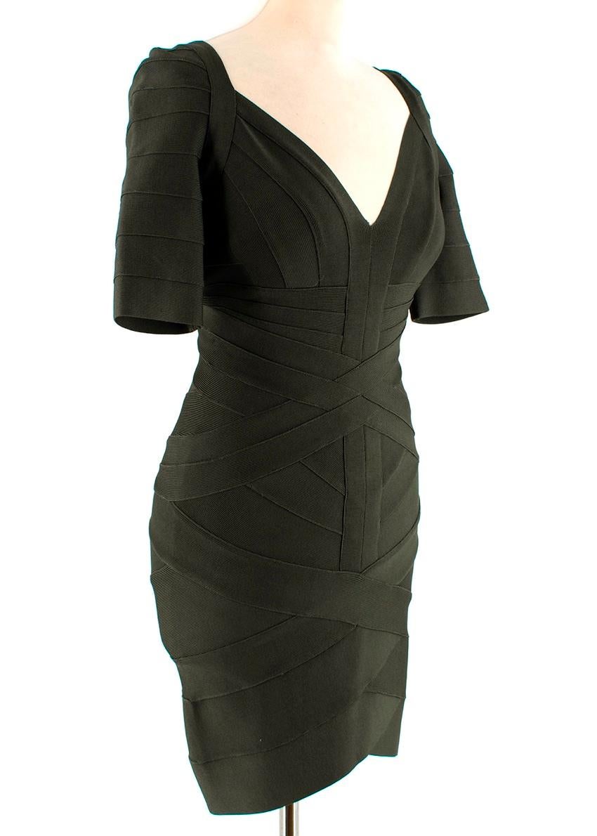 Herve Leger Green Bandage Short Sleeve Mini Dress 

-Signature Knit stripes texture -Gorgeous forest green colour 
-Crossed stripes effect to the waist 
-Central panel that divides to form the neckline 
-Elegant short sleeve design 
-Zip fastening