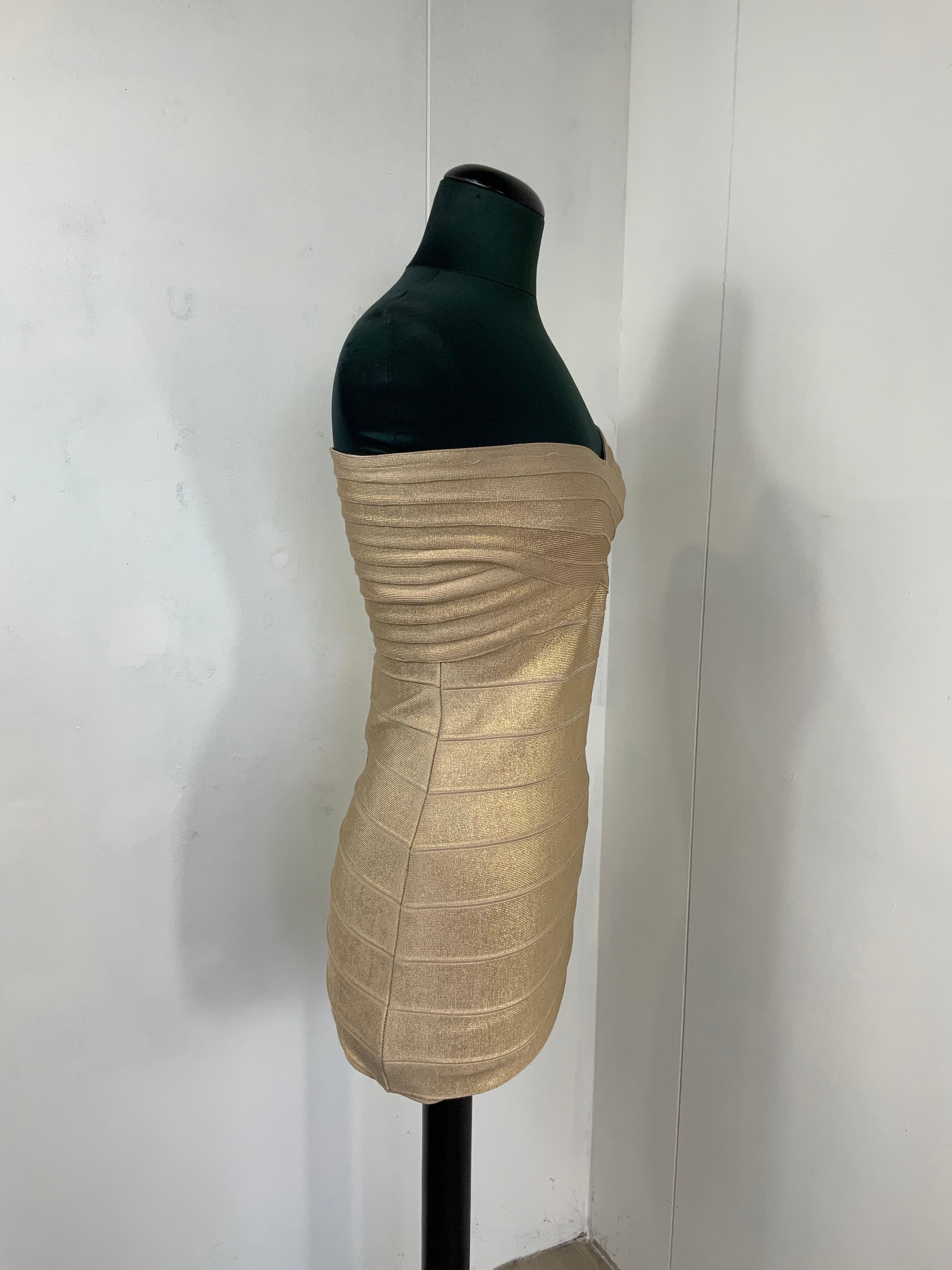 Herve Leger golden dress 
Composition tag is missing. Fabric is elastic.
Size L. But it fits tight.
Bust 36 cm
Waist 33 cm 
Length 64 cm
Conditions- very good. It shows some normal use signs and some pulled threads.