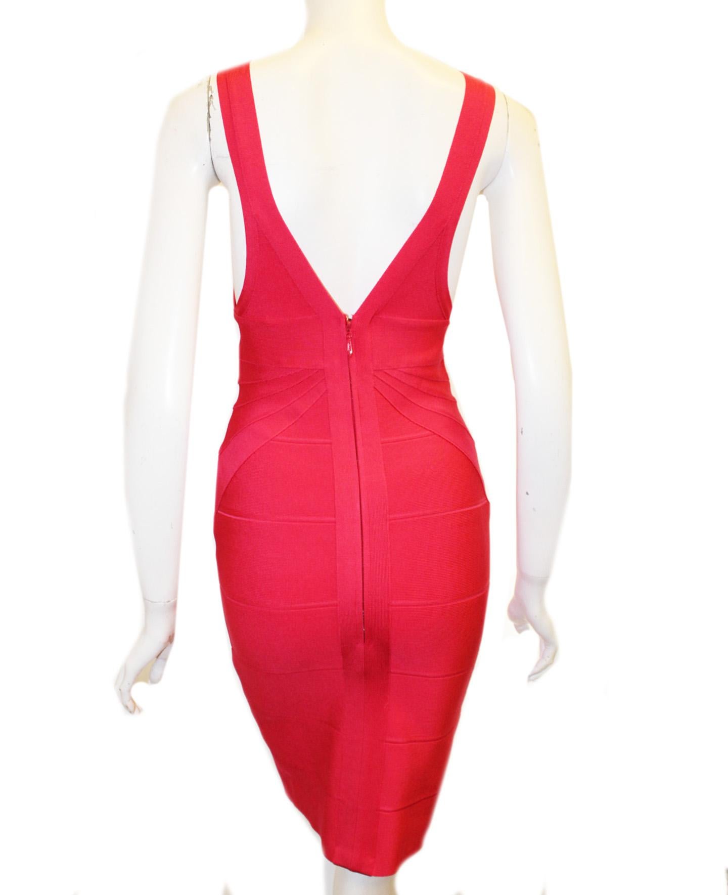 Herve Leger hot pink bandage V neck body con dress is a closet essential.  Named 