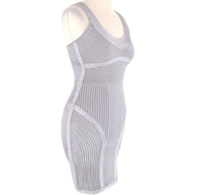 Herve Leger Ice Grey Mini Bandage Dress

- Scoop neckline
- Concealed zip fastening in the center of the back
- Bodycon fit
- Accentuated waistline
- Structured
- Mini dress

Material:
90% Rayon
9% Nylon
1% Spandex

Hand wash cold, line dry. Do not