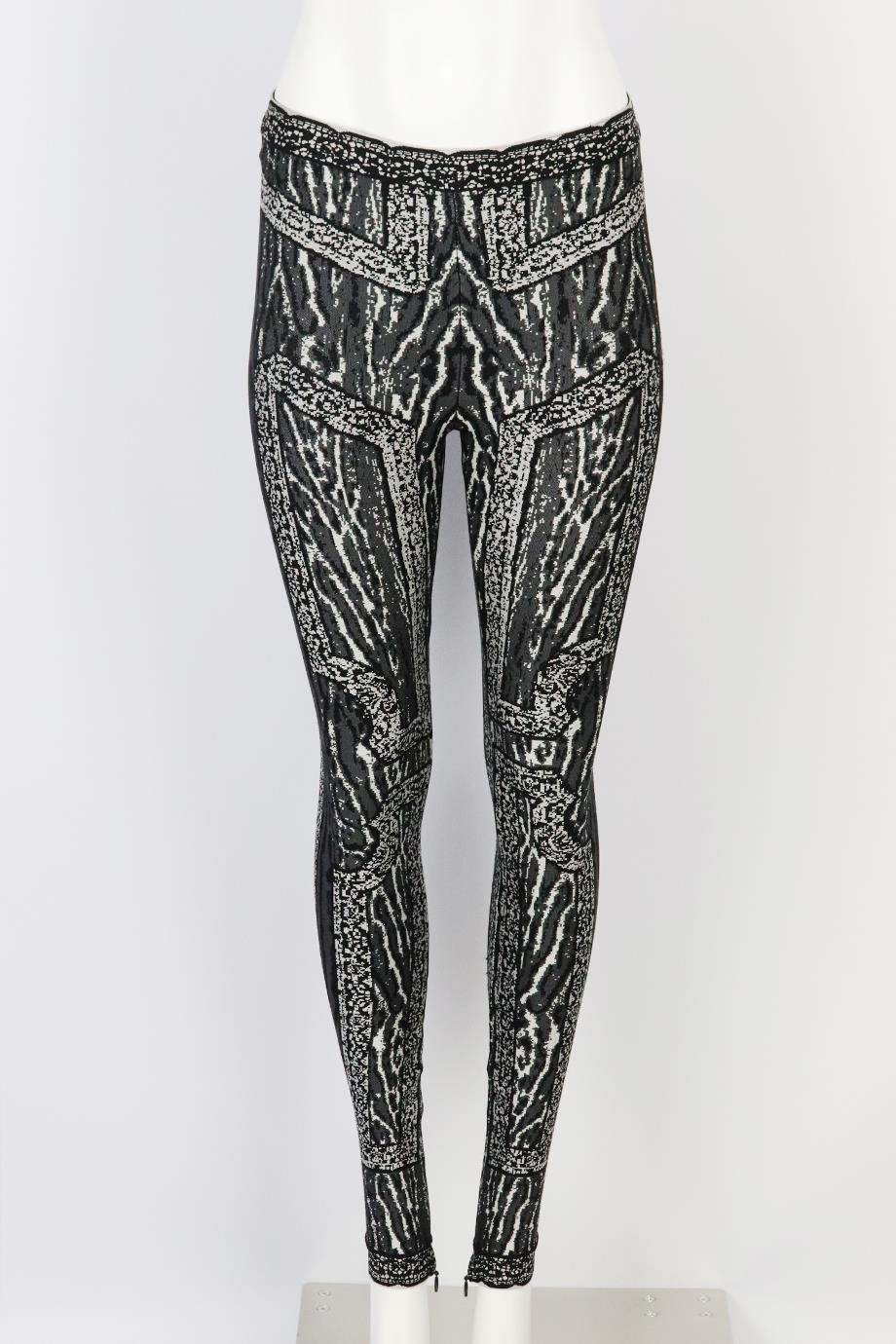 Herve Leger jacquard knit leggings. Grey, silver and black. Pull on. 75% Rayon, 23% nylon, 2% spandex. Size: XSmall (UK 6, US 2, FR 34, IT 38). Waist: 25 in. Hips: 32 in. Length: 37 in. Inseam: 29 in. Rise: 9 in. Very good condition - No sign of