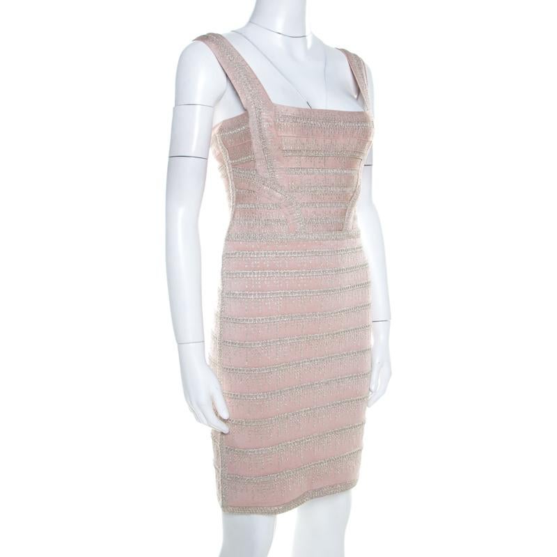 Herve Leger brings to you this fabulous light pink dress suitable for all fashionable outings. Ingeniously crafted from knit bandages, the rayon blend dress features zip closure at the back. Complementing pumps and a handbag will automatically spice
