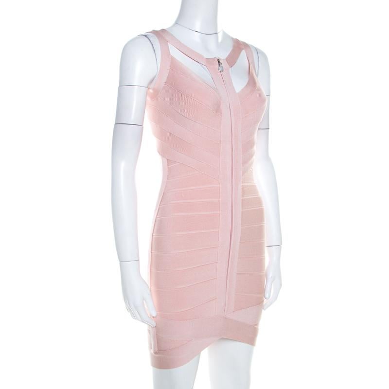 Herve Leger brings to you this fabulous light pink dress suitable for all fashionable outings. Ingeniously crafted from knit bandages, the rayon blend dress features zip closure at the front. Complementing pumps and a handbag will automatically
