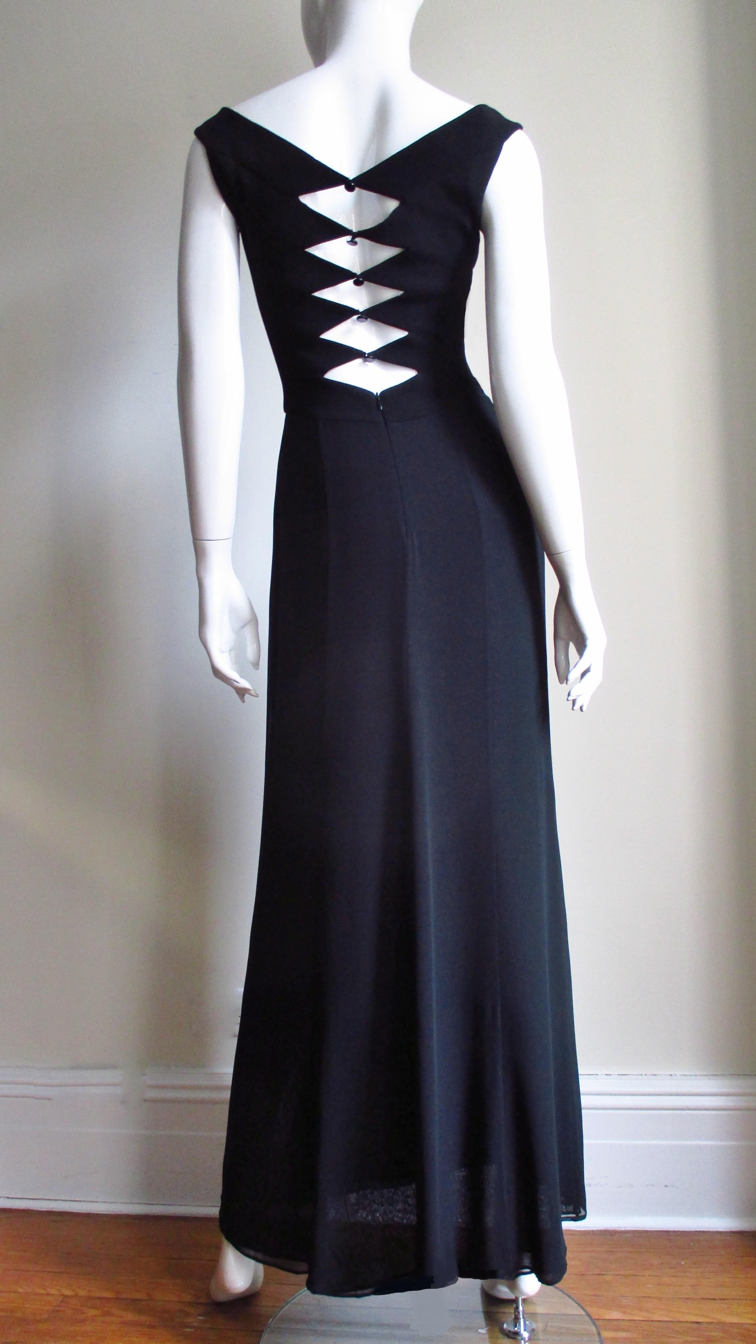 A gorgeous black silk and wool dress, gown by Herve Leger.  It is sleeveless, semi fitted with a square cut neckline and 3 layer silk skirt falling straight in front, flaring subtly in the back.  There is elaborate detail in the back of the bodice