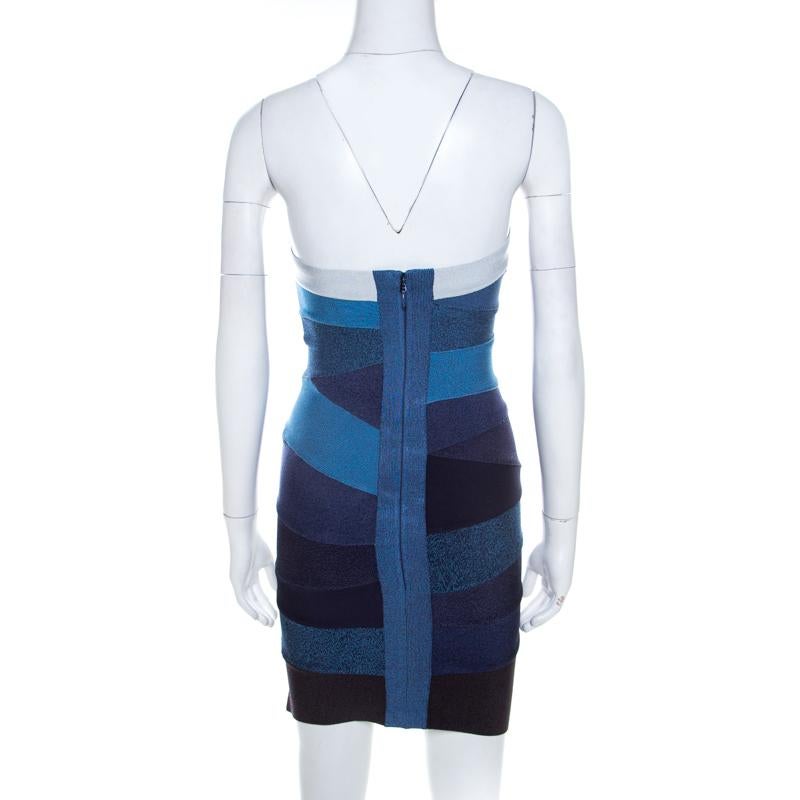 Herve Leger brings to you this fabulous ombre blue dress suitable for all fashionable outings. Ingeniously crafted from knit bandages, the rayon blend strapless dress features asymmetric stripes. On the back is a concealed zip closure. A statement