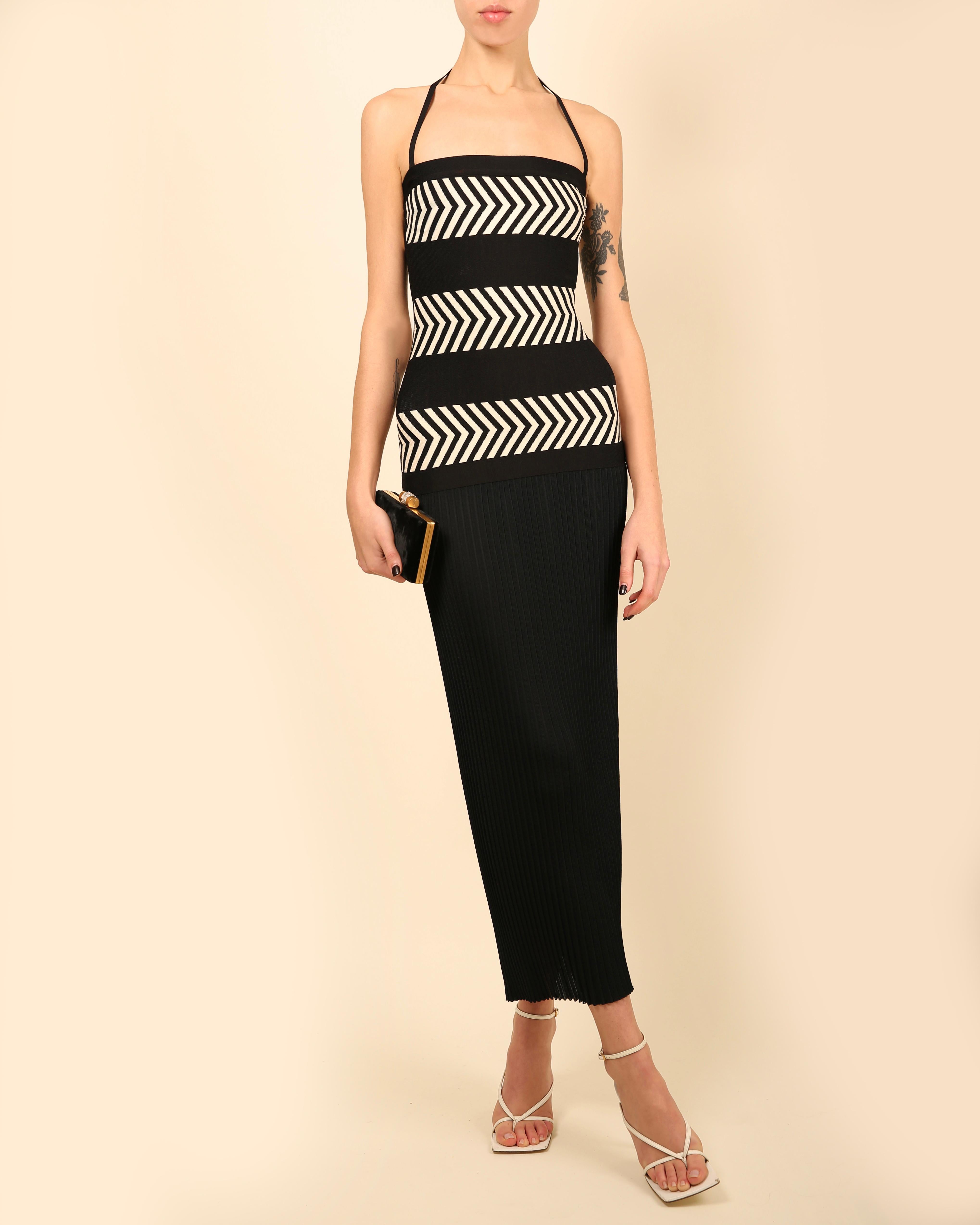 LOVE LALI VINTAGE

A gorgeous vintage full length dress from Herve Leger Paris
Black with three bands of ivory print
The halter strap is detachable so that the dress can be worn strapless
The upper part of the dress is composed of the classic Herve