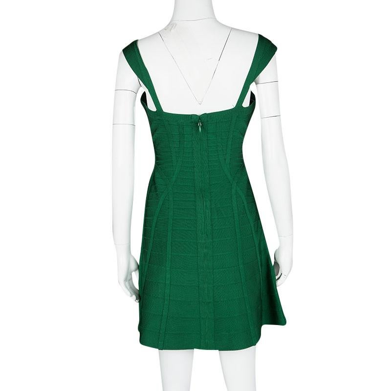 Cut from the label's signature bandage fabric, this Mayra dress from Herve Leger elegantly sculpts the figure and subtly flutes towards the hemline. The sleeveless style features a refreshing pine green body and comes with a wide V-neckline.