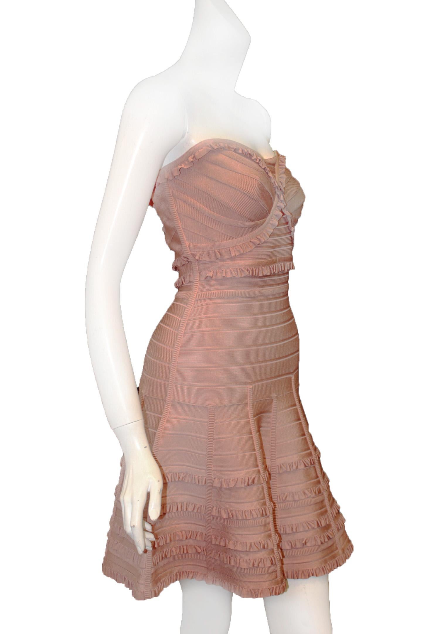 Herve Leger pink strapless dress to bedazzle the crowd with a stunning style statement in this classic Akari mini dress.  Fashioned in a strapless silhouette with the signature bandage construction, the dress has a fitted bodice with a sweetheart