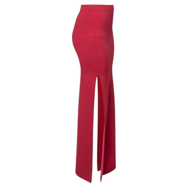 Incorporate a stunning appeal into your outfit with this gorgeous number from Herve Leger. Fashioned in stretch knit fabric, this red maxi skirt is accentuated with a fitted style and high slits. A zipper is added for fastening. Pair this skirt with