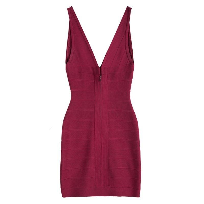 A body-con closet essential, this Herve Leger banded, formfitting dress features a V neck and back for a classic evening look that never goes out of style. The figure-defining bands accent the bodice, and the V neckline flows into a scoop back with