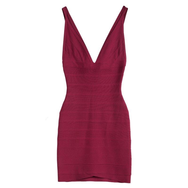 A body-con closet essential, this Herve Leger banded, formfitting dress features a V neck and back for a classic evening look that never goes out of style. The figure-defining bands accent the bodice, and the V neckline flows into a scoop back with