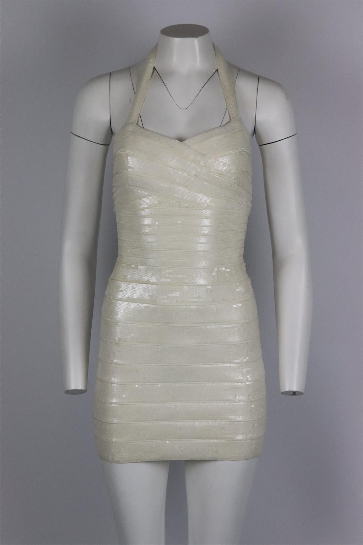 Herve Leger sequined bandage mini dress. Ivory. Sleeveless, halterneck. Zip fastening at back. 90% Rayon, 9% nylon, 1% spandex. Size: Small (UK 8, US 4, FR 36, IT 40) Bust: 32 in. Waist: 25 in. Hips: 34 in. Length: 28 in. Good condition - Some