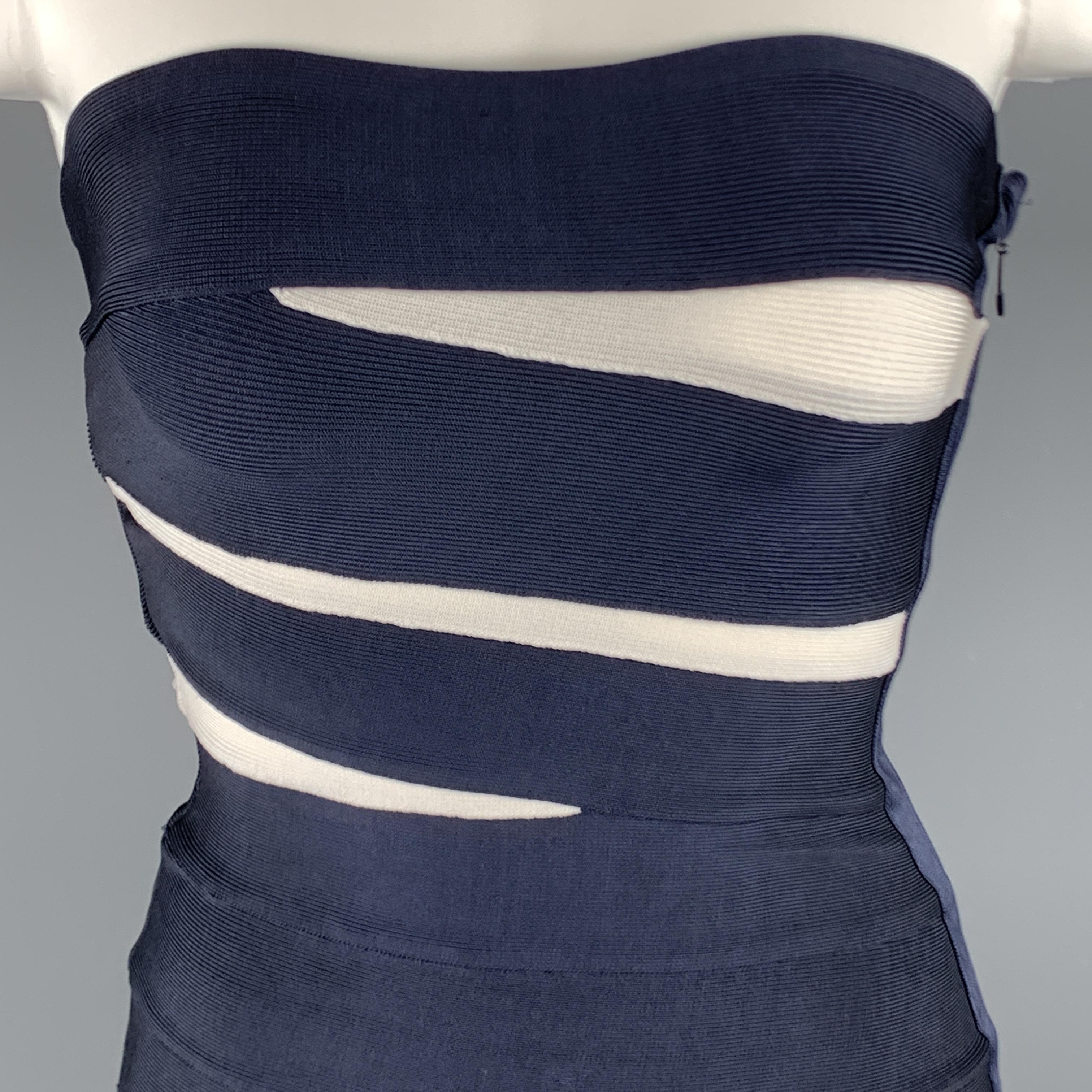 HERVE LEGER sheath dress comes in navy and white stretch bandage material with a side zip. Lots of stretch.

New with Tags.
Marked: S

Measurements:

Bust: 28 in.
Waist: 22 in.
Hip: 30 in.
Length: 29 in.
