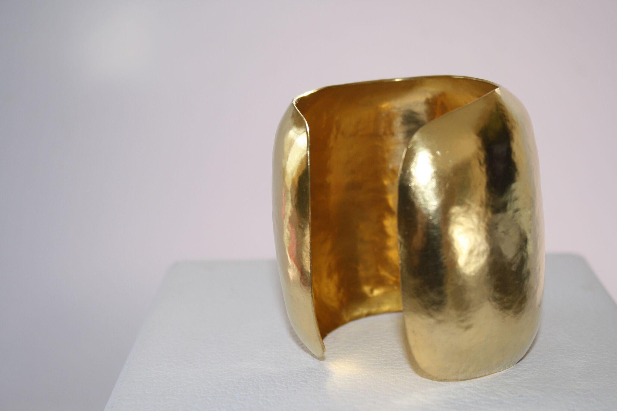 Solid brass plated with 24k gold and hand hammered by Herve van der Straeten. This iconic designer is no longer producing jewelry, making all remaining pieces collectors items. 
3 “ tall 
2” diameter
flexible vintage 