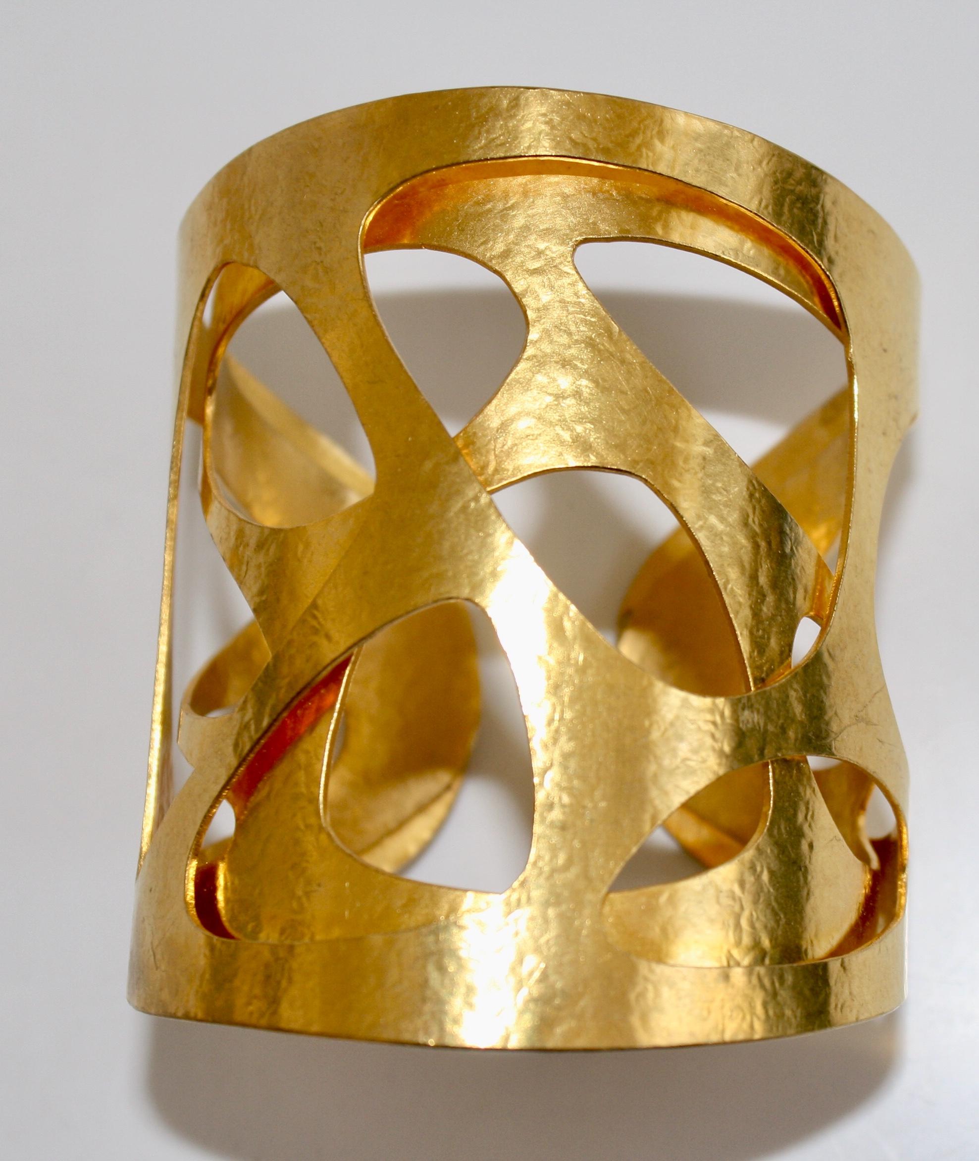 Gilded brass Giraffe cuff from Herve van der Straeten. This designer is no longer producing jewelry, making all remaining pieces collectors items. Cuff is adjustable, fits wrists both large and small. 