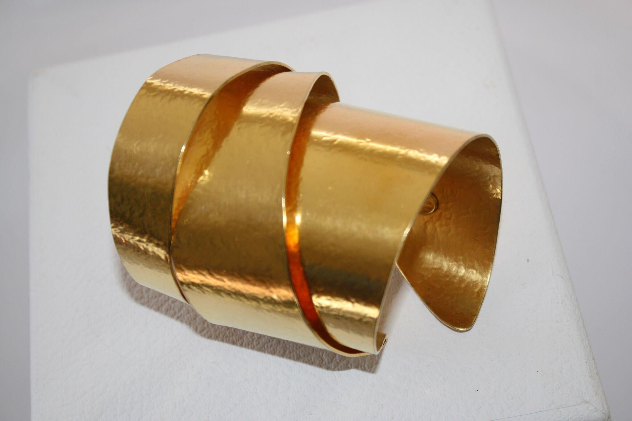 Gilded brass flexible cuff bracelet from Herve van der Straeten. This designer is no longer producing jewelry, making all remaining pieces collector's items. 
3” long
diameter 2 1/4 