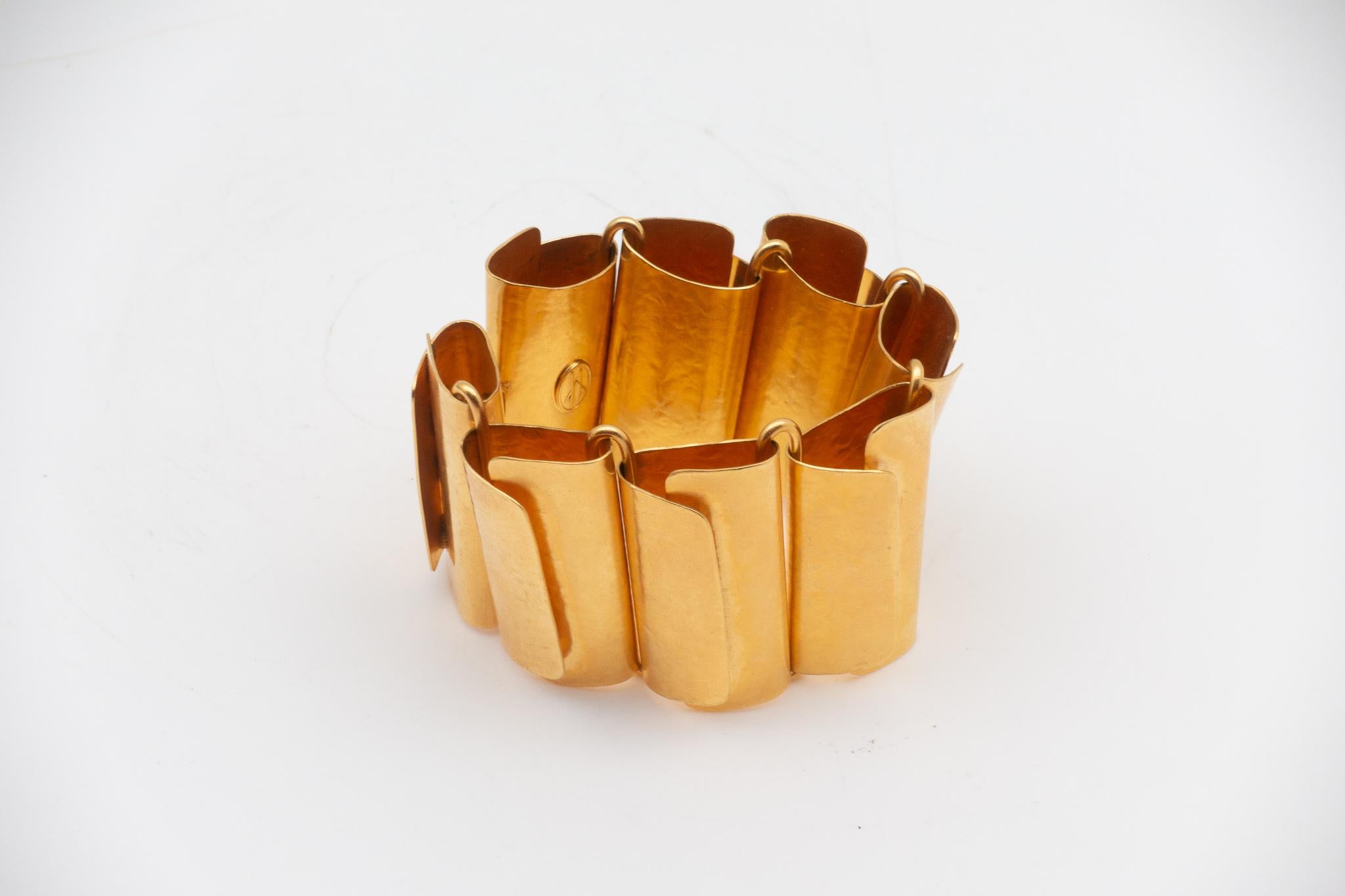 Highly collectable Hervé Van Der Straeten hammered gold-plated brass bracelet. Hervé Van Der Straeten has discontinued making jewelry to focus more on his furniture line. His pieces have been collected the world over for decades. This is truly one