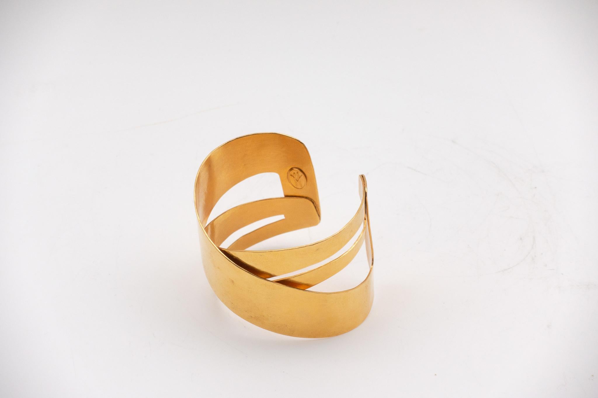 Highly collectable Hervé Van Der Straeten hammered gold plated brass bracelet. Hervé Van Der Straeten has discontinued making jewelry to focus more on his furniture line. His pieces have been collected the world over for decades. This is truly one